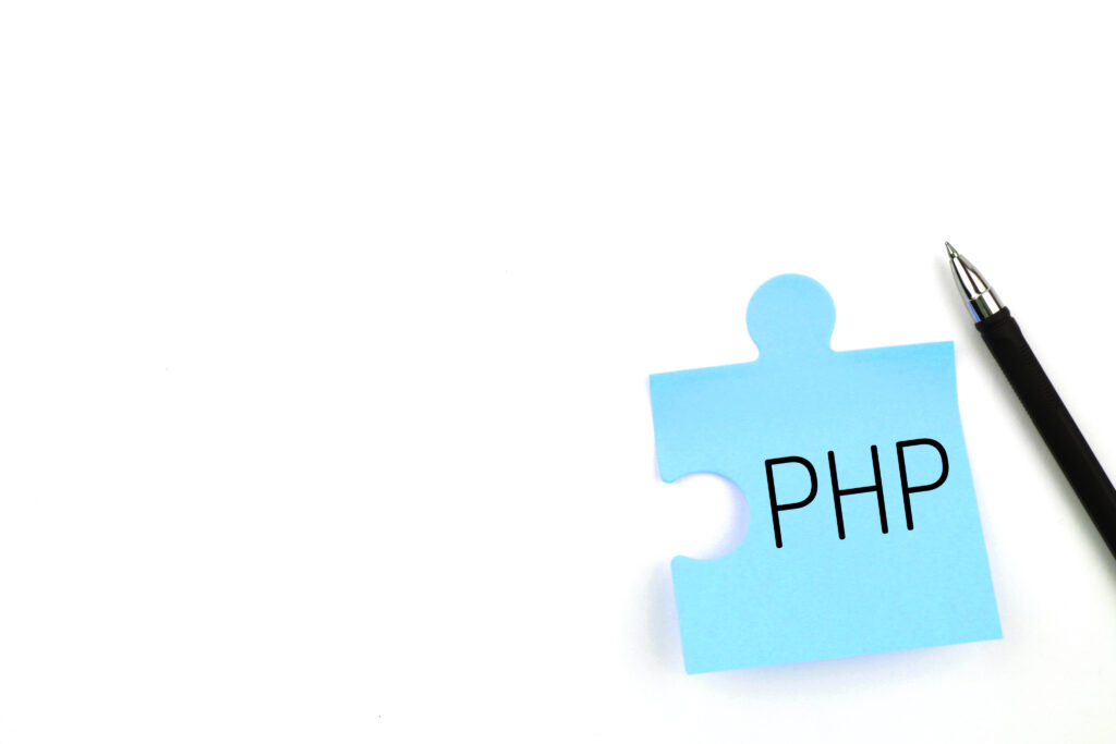 Notizzettel in Puzzelform mit de Aufschrift PHP